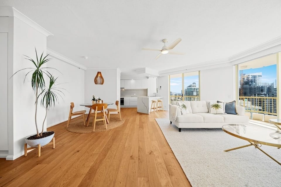 Main Beach Escape living room with Smart TV, dining table, kitchen and outlooks.