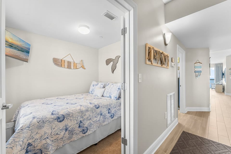 View of bunk room with full size bed.