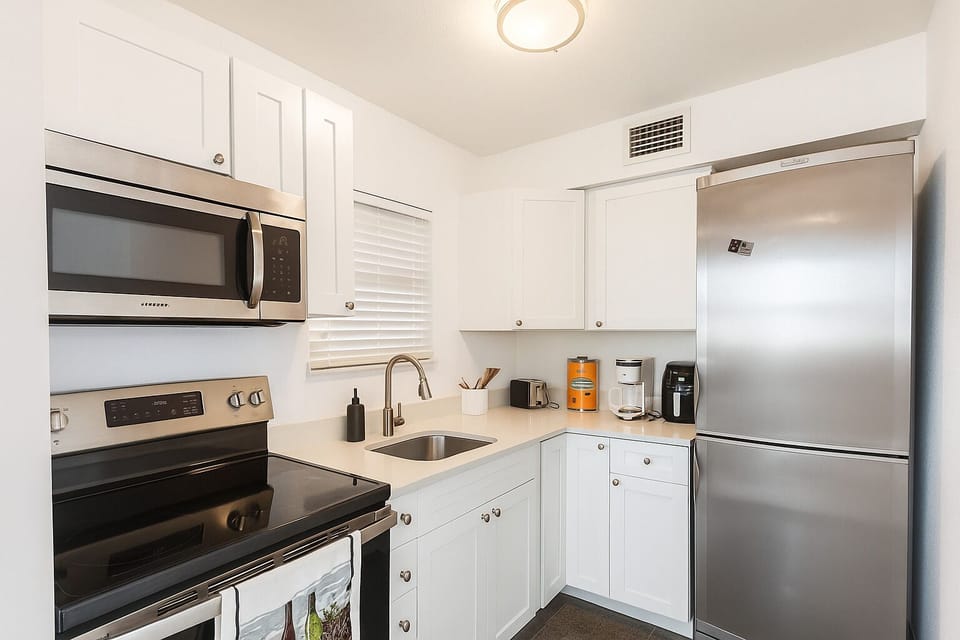 Pots pans dishes silverware utensils toaster microwave it has it all 