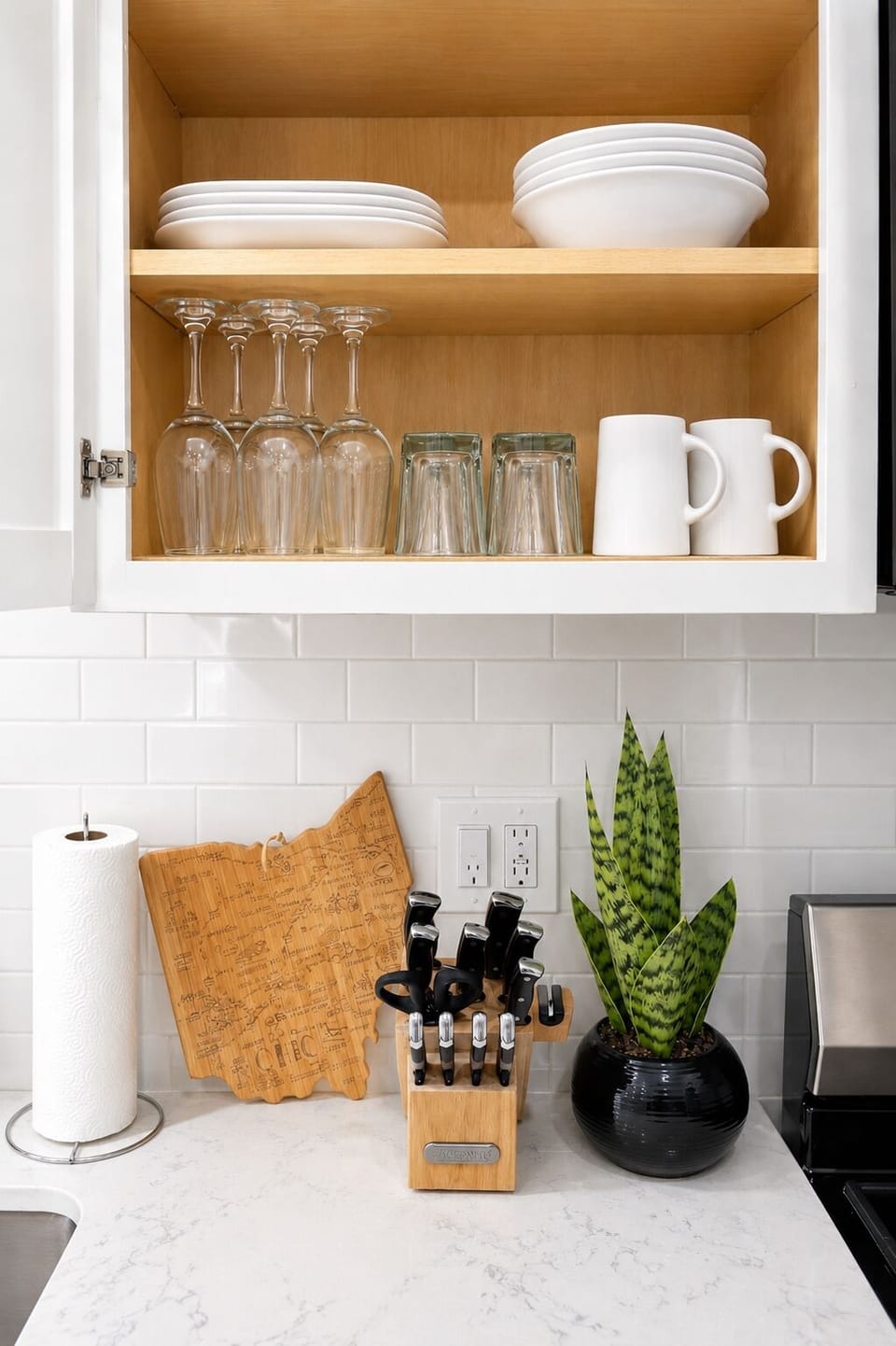Boutique-style kitchen details with stocked essentials for cooking