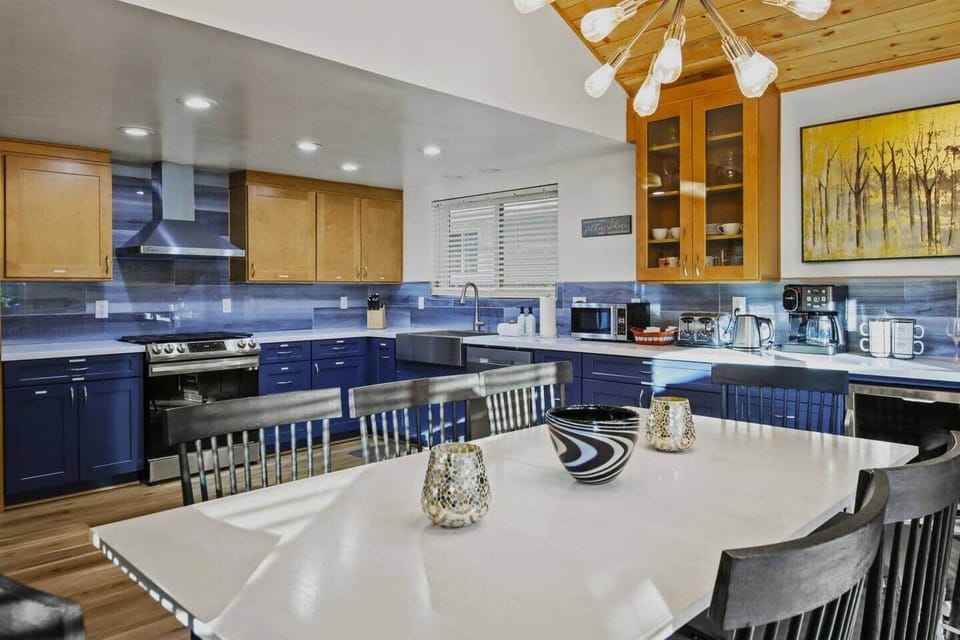 Seamless connection between the kitchen and, dining, and living areas.