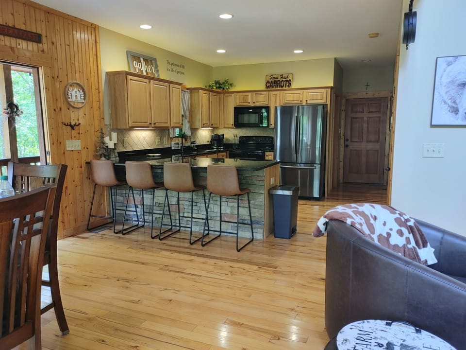 Kitchen off the Open Living Space with Bar Stools.