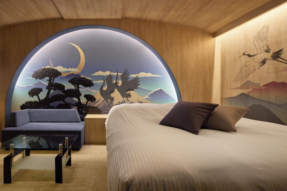 Executive Suite | Minibar, in-room safe, individually decorated, soundproofing