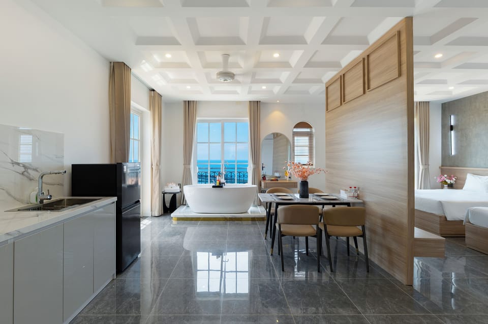 Deluxe Quadruple Room, Balcony, Beach View | Living area