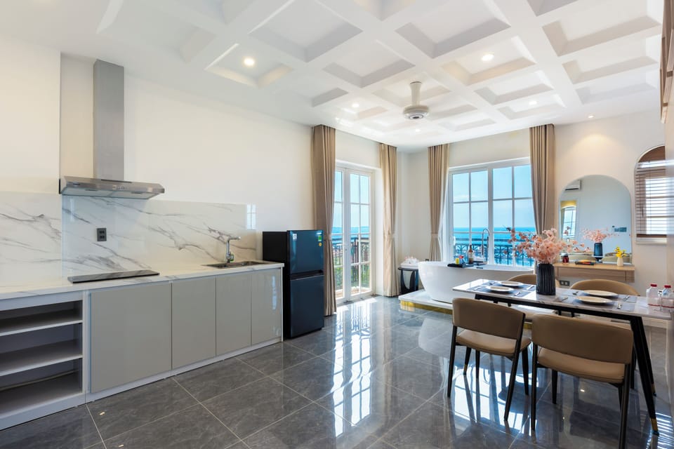 Deluxe Quadruple Room, Balcony, Beach View | Living area