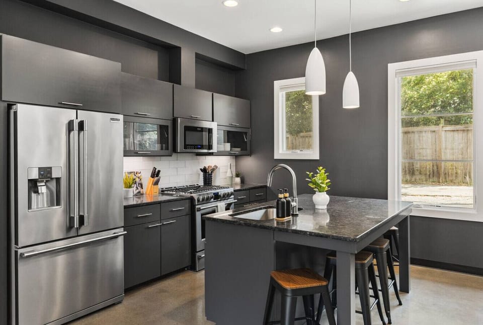 Updated, fully-equipped kitchen with high-end appliances and seating for four at the counter. Enjoy the drip coffee maker + coffee grounds in the morning.