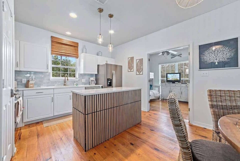 Enjoy a fully remodeled kitchen with stainless steel appliances, quartz countertops, and a farmhouse sink. It’s stocked with all the essentials — pots, pans, dishes, utensils, a drip coffee maker with filters, crockpot, and blender.