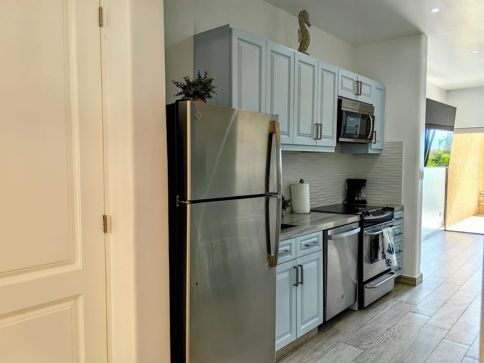 The kitchen has a full pantry (door on left)