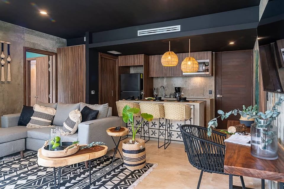 Kitchen, dining, living room view with a dedicated workspace. 