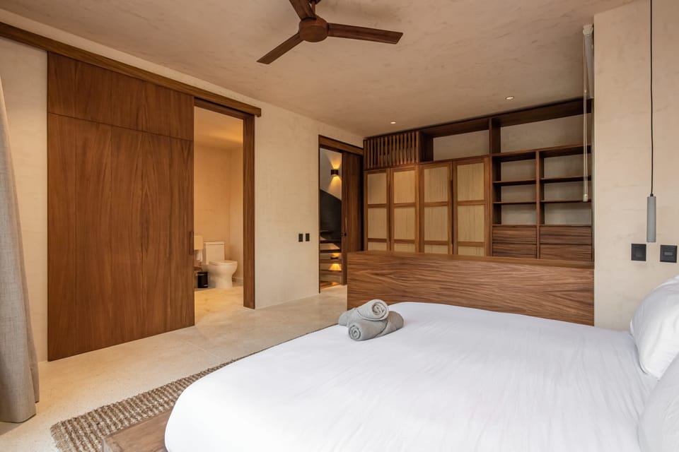 Bedroom No. 1 features its own private bathroom and a king-size bed.