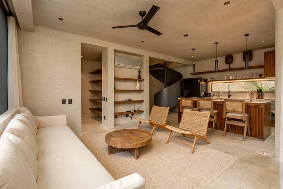 The living room is spacious and features comfortable sofas, perfect for spending quality time with your group or family.