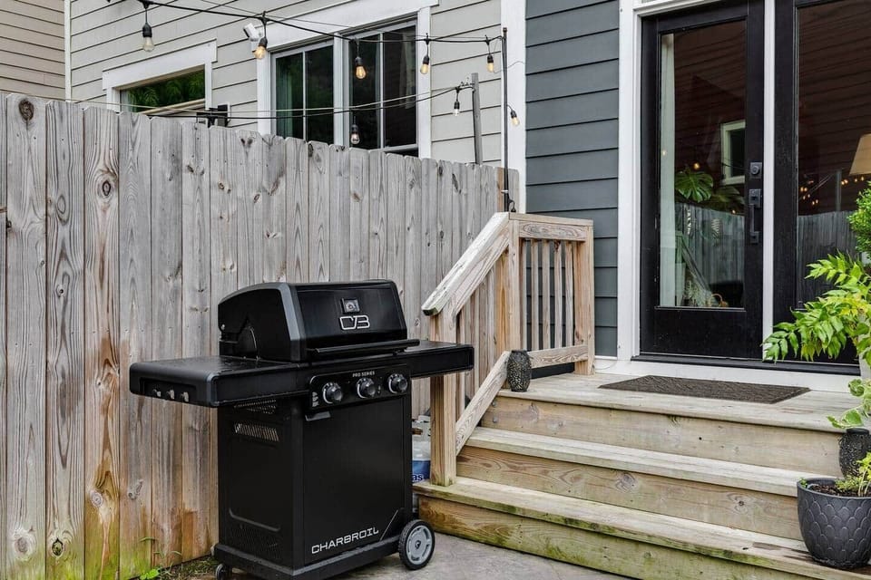 Gas grille with cast-iron griddle section.