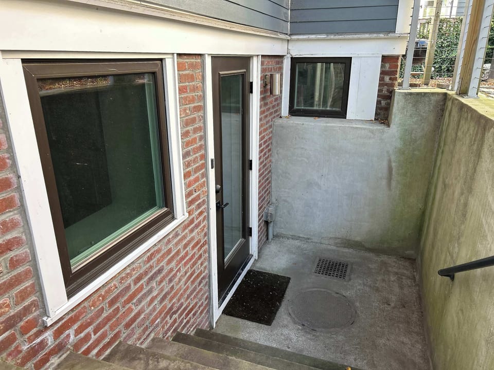 Garden studio is located in the rear of the house down a flight of 6 steps 