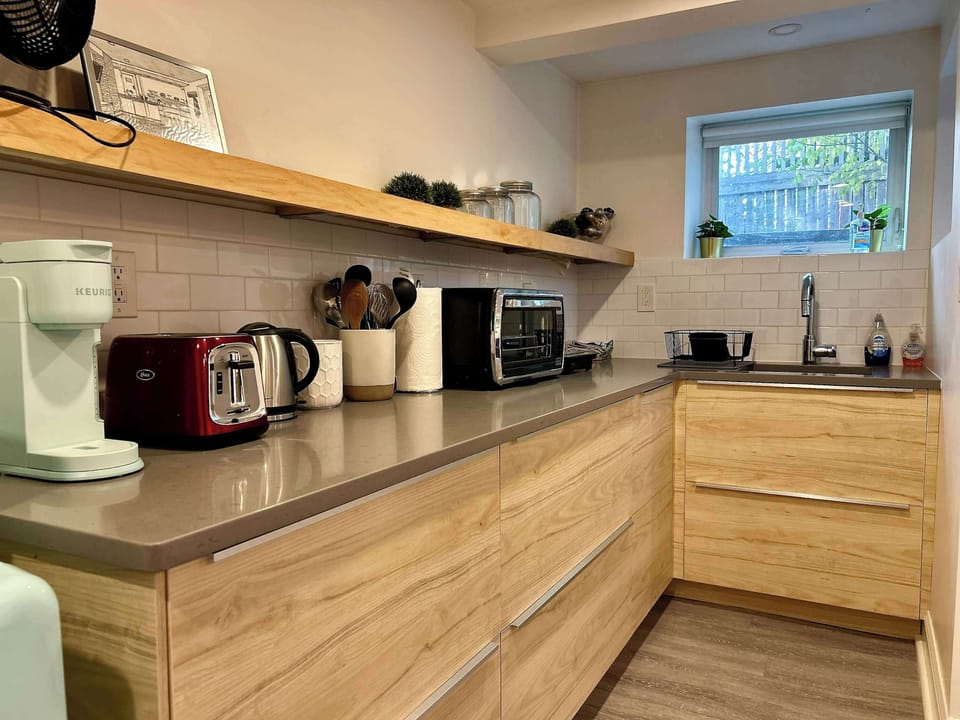 Updated kitchenette with coffee maker, fridge, microwave, hot plate, and toaster