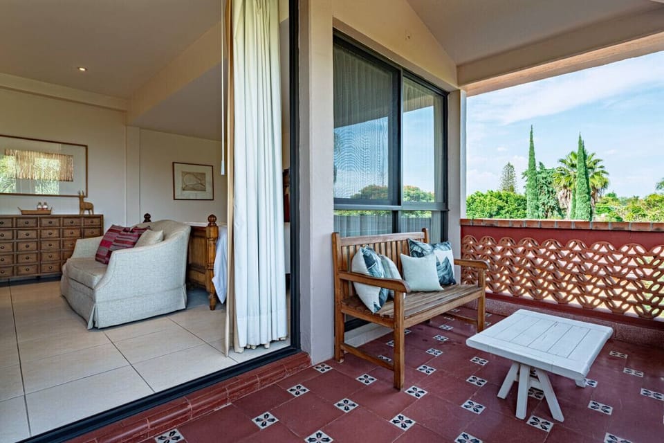 Relax indoors or on your private balcony with lush Cuernavaca views.
