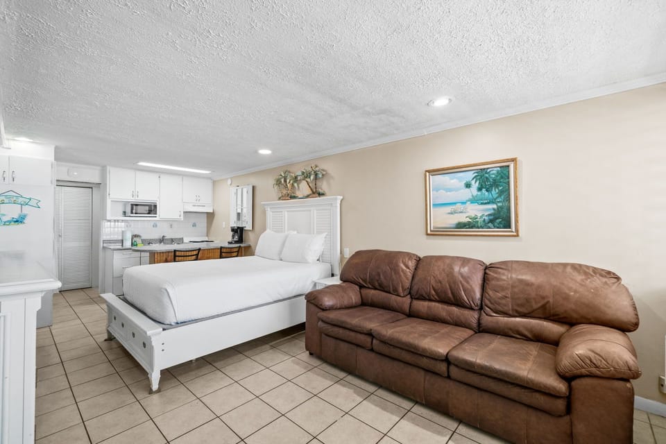 Living Area with Queen Bed and Sleeper Sofa