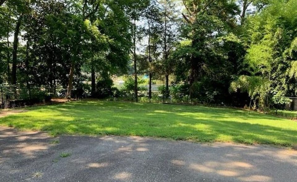 Backyard backs up to YMCA tennis courts