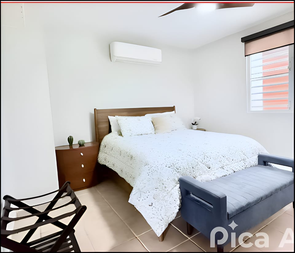 Master bedroom with A/C and premium amenities for a perfect stay.