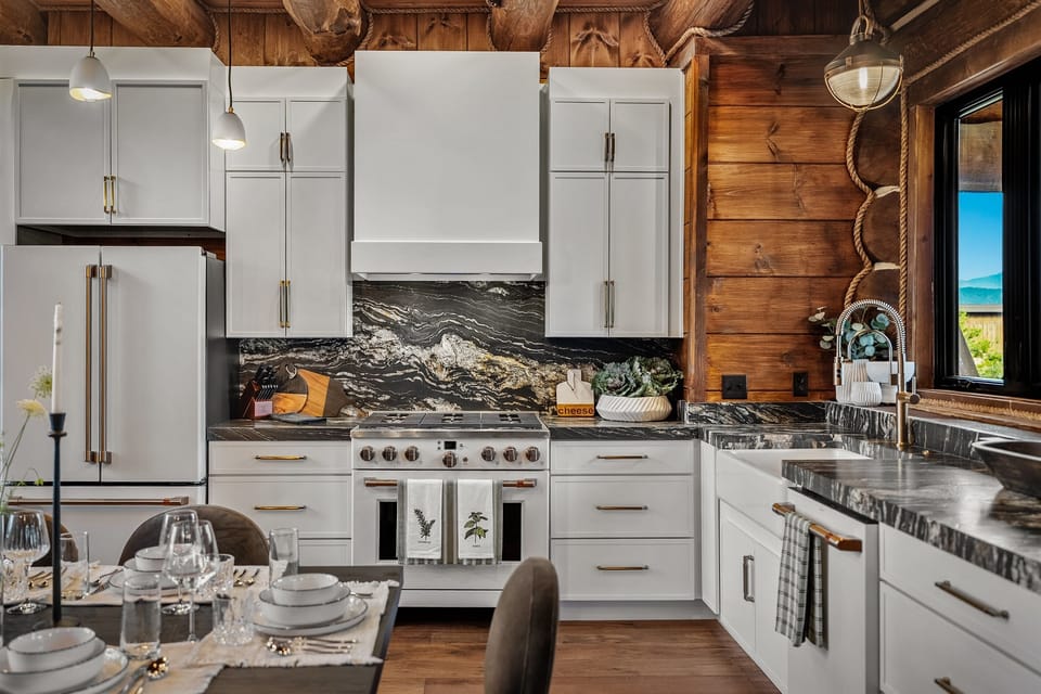 Fully equipped gourmet kitchen with premium appliances, generous counter space, and room for multiple cooks