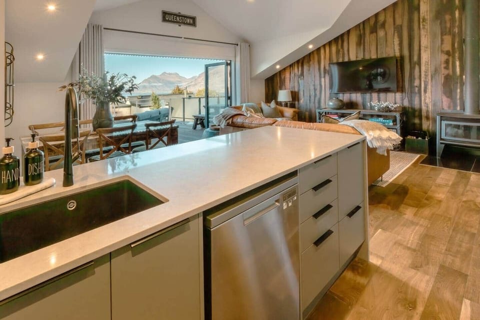 Kitchen with mountain and lake views