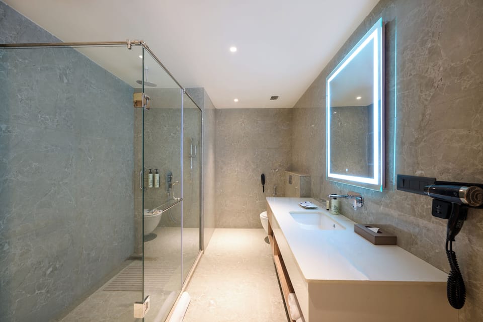 Suite, 1 King Bed | Bathroom | Slippers