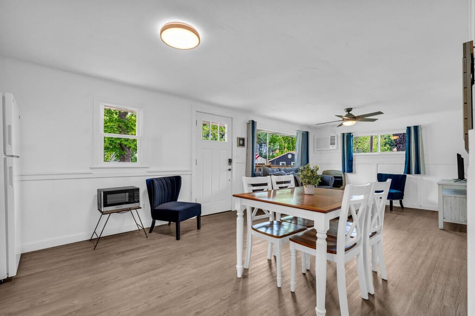 Open layout, easy flow. This space blends dining and lounging with room to relax after a day at the beach.