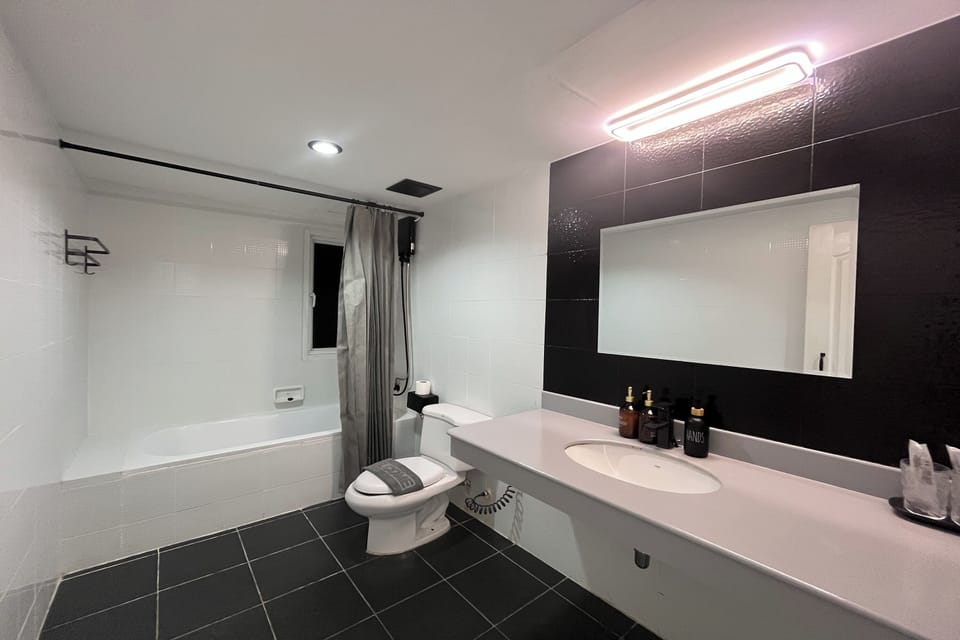 Grand Room, 1 King Bed, Terrace, Sea View | Bathroom | Hair dryer, slippers, towels, soap