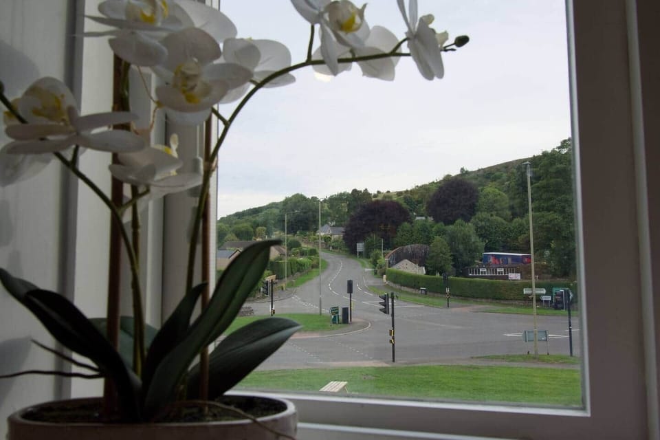 Start your morning with a brew and this classic Peak District view. Calver crossroads – where village charm meets rolling hills.