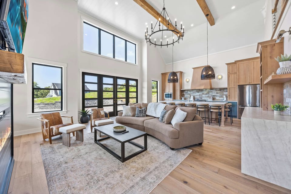 Living Room 1: Imagine cozy evenings spent on this plush sofa, surrounded by natural light and elegant design. This living room is the heart of your home away from home.