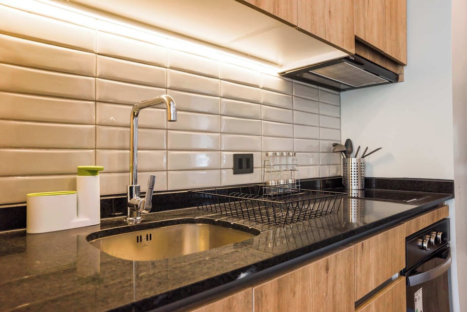 Modern kitchen with sleek finishes and under-cabinet lighting, perfect for cooking and entertaining.