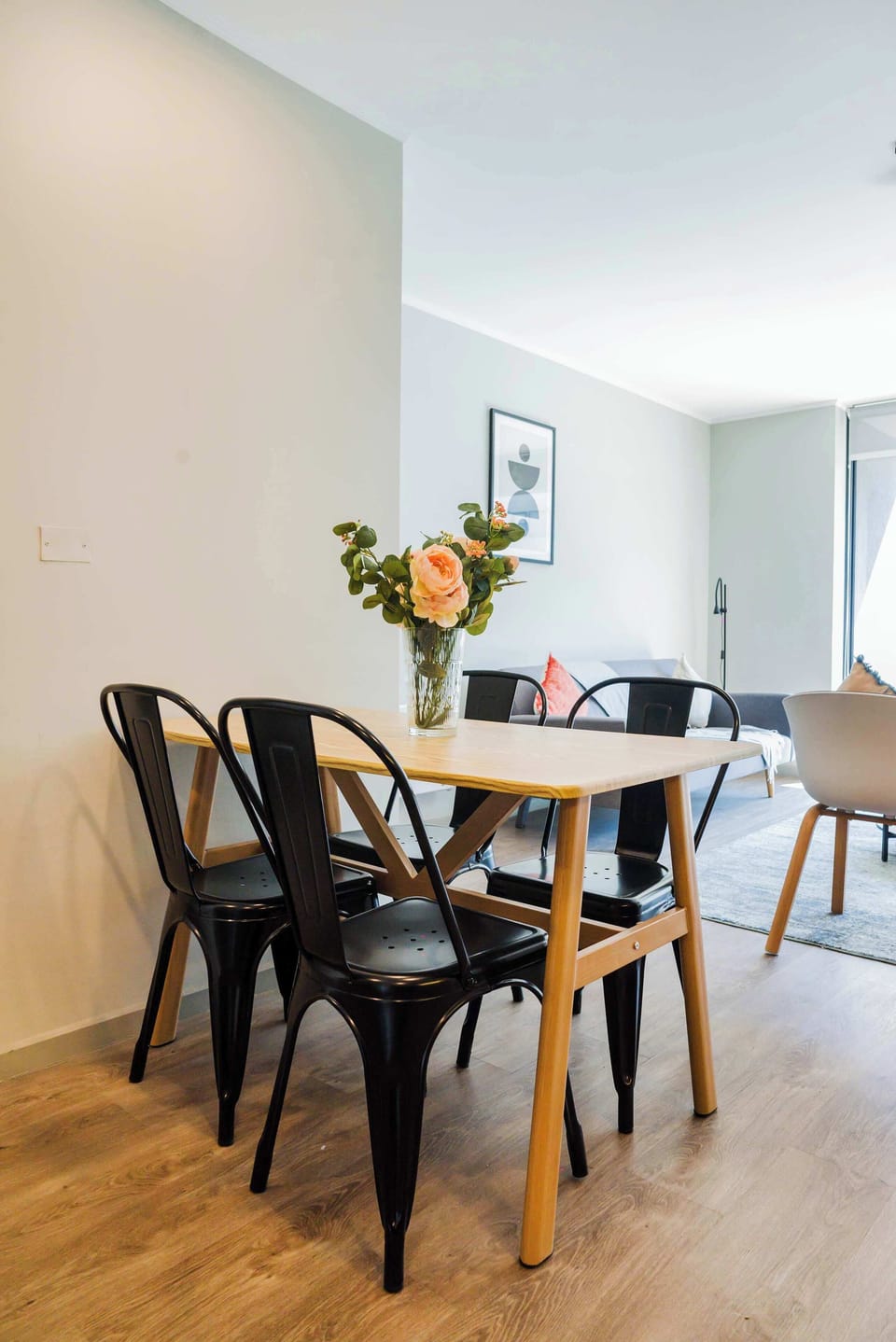 Cozy dining area with stylish seating and natural light, perfect for intimate meals.