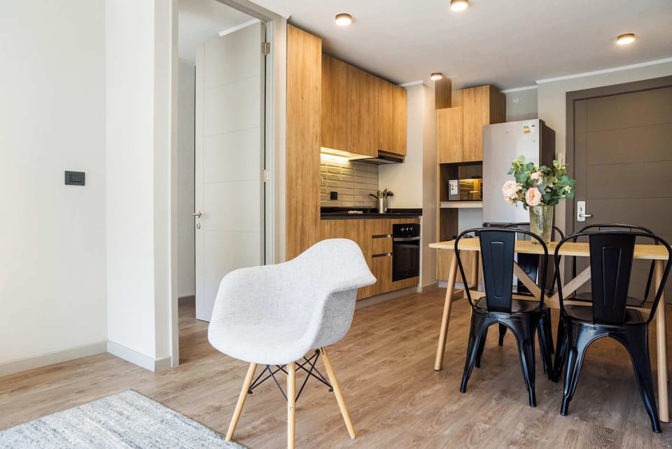 Cozy and modern kitchen with stylish dining area, perfect for enjoying meals and gatherings.