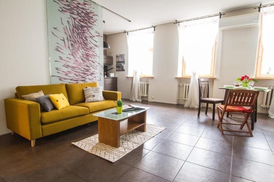 Relax on the vibrant mustard sofa