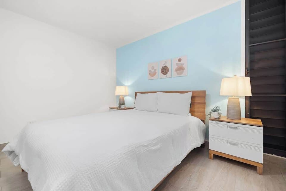 A clean and cozy bedroom with a minimalist design.


