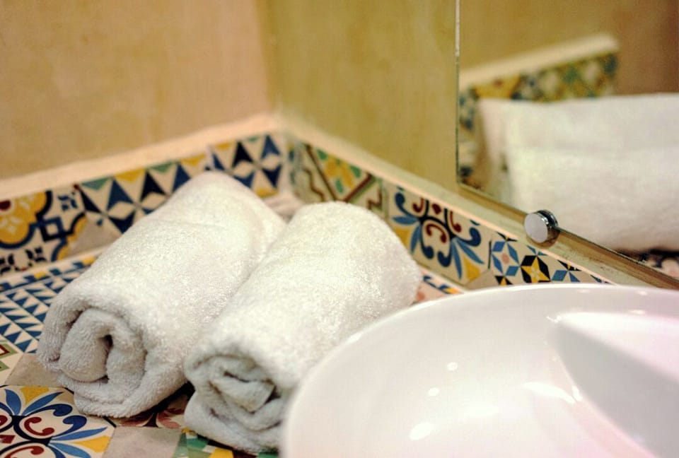 Shower, hair dryer, bathrobes, towels