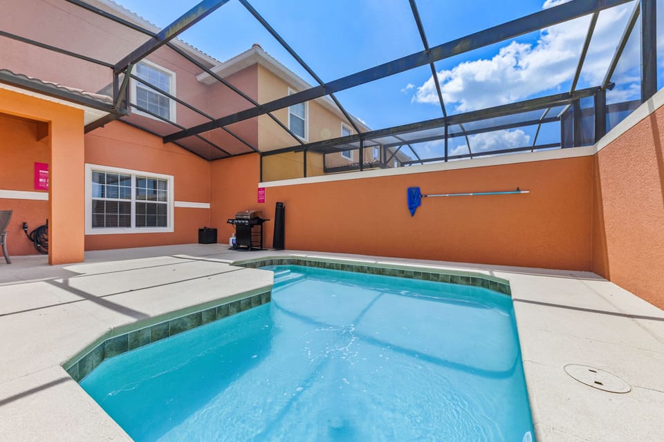 Private pool with a BBQ grill