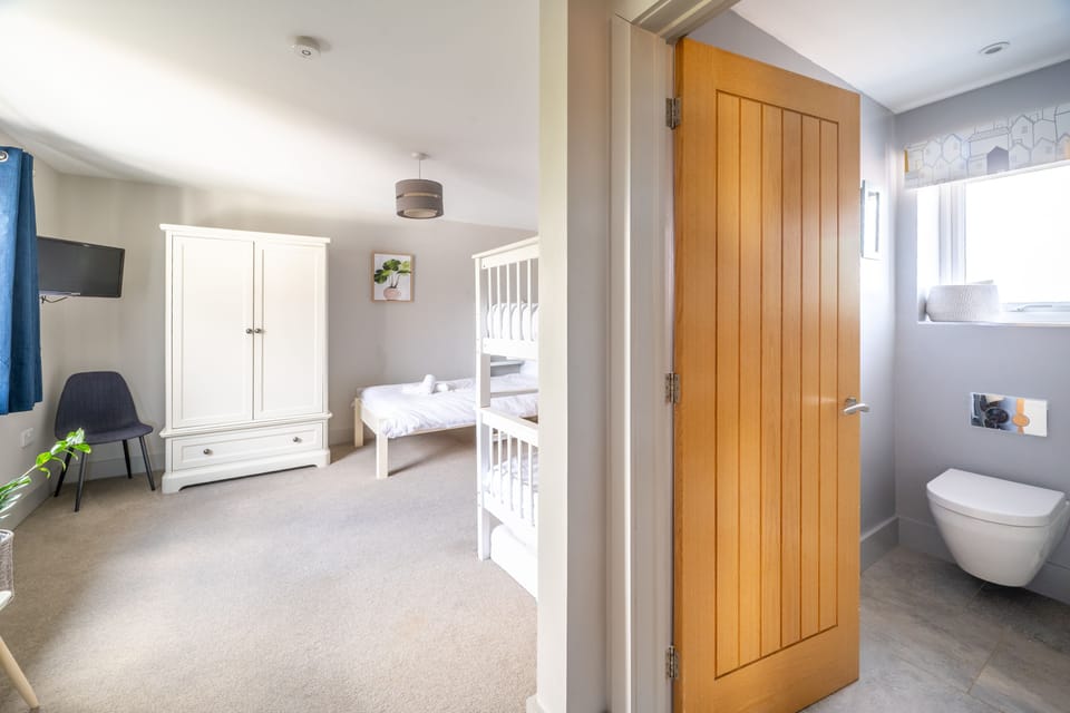 First floor: Bedroom four with en-suite shower