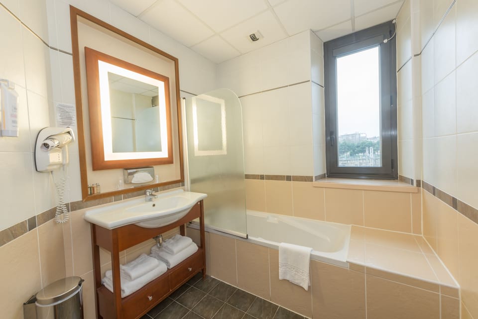 Eco-friendly toiletries, hair dryer, towels