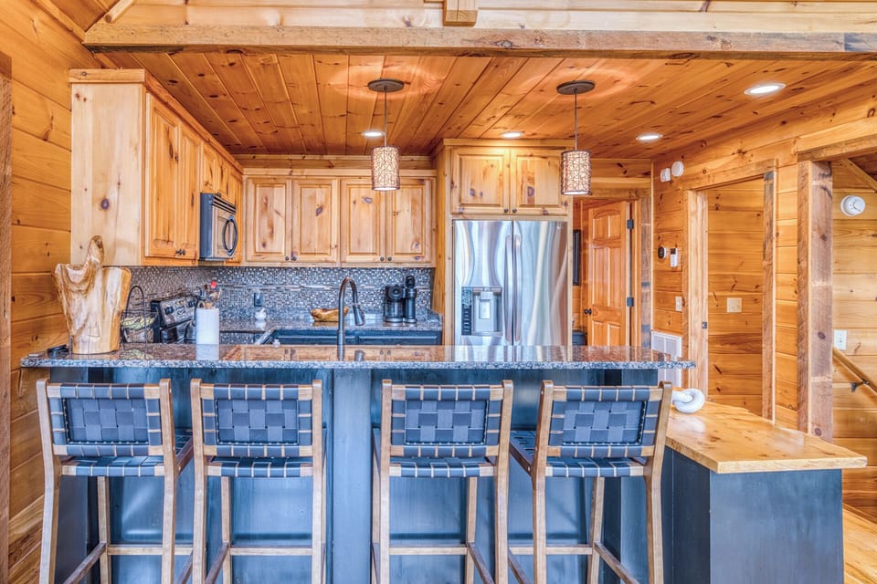 Enjoy a open kitchen w/ granite counters, island seating, coffee bar & more.