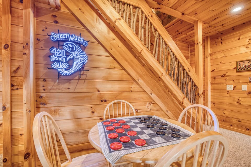 Enjoy classic game nights w/ a checkers table, cozy seating & rustic charm.