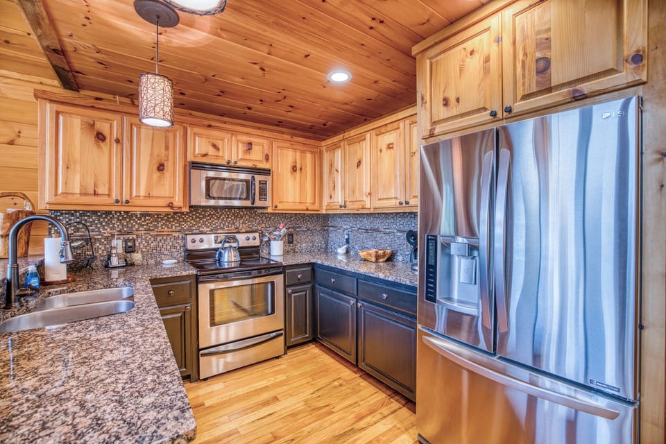 Cook with ease in the kitchen w/ granite countertops, appliances & coffee bar.