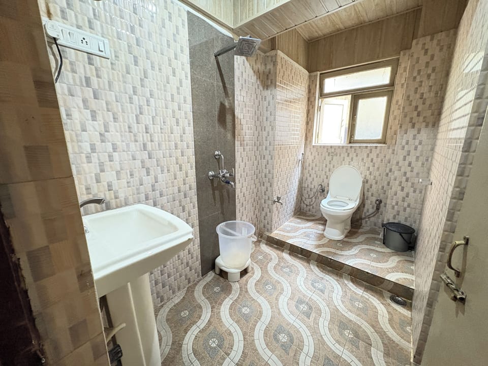 Deluxe Room, 2 Queen Beds | Bathroom | Shower, towels, soap, shampoo