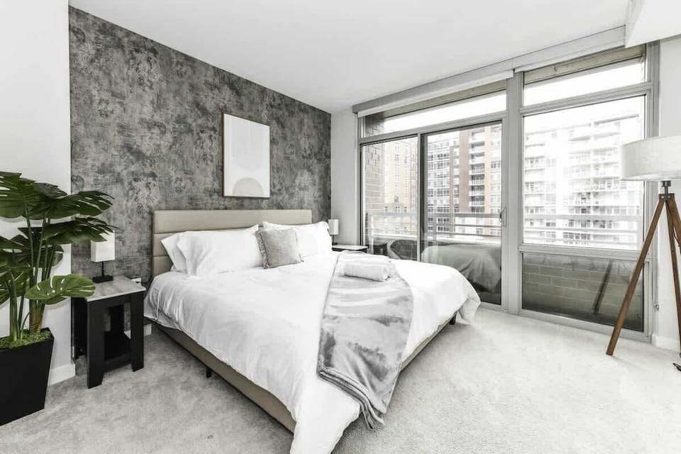 Bedroom 1 with cozy king bed, and large windows