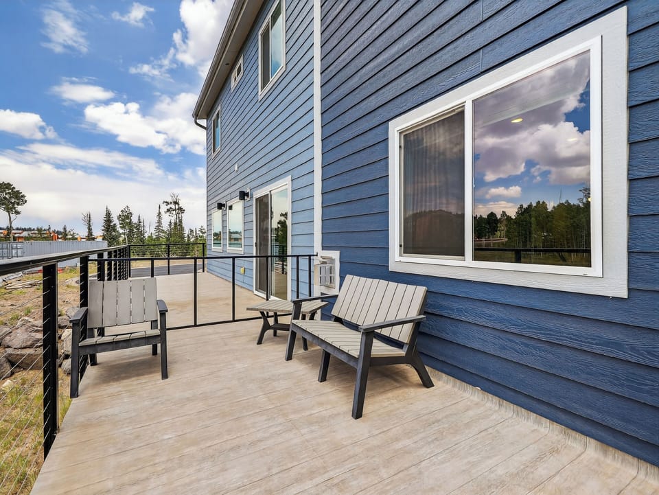 Deck with outdoor seating and a BBQ grill—perfect for al fresco dining and enjoying the mountain air