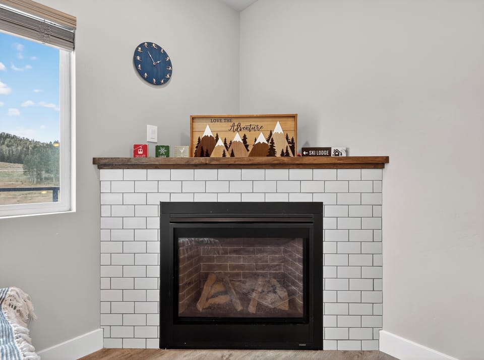 View of the cozy gas fireplace located in the living room