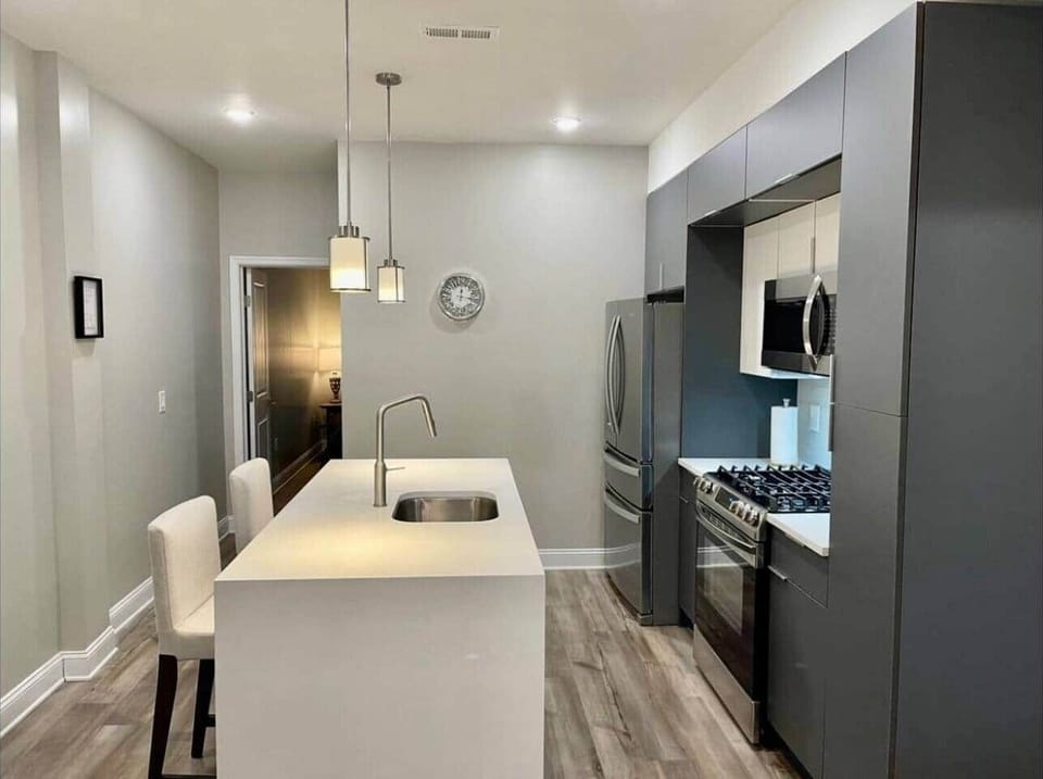 Full kitchen with all the amenities and waterfall breakfast bar.