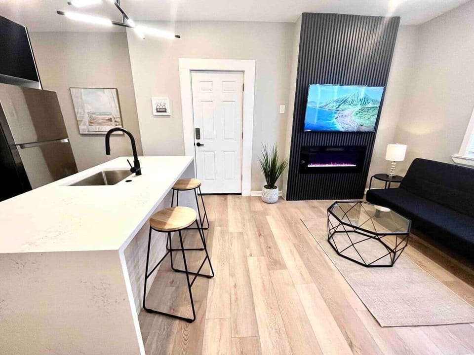 Brand new kitchen and appliances with breakfast bar, dishwasher ,microwave, refrigerator. 
Joined with the living room with futon sofa bed, large flat screen tv , fireplace and dining room. 