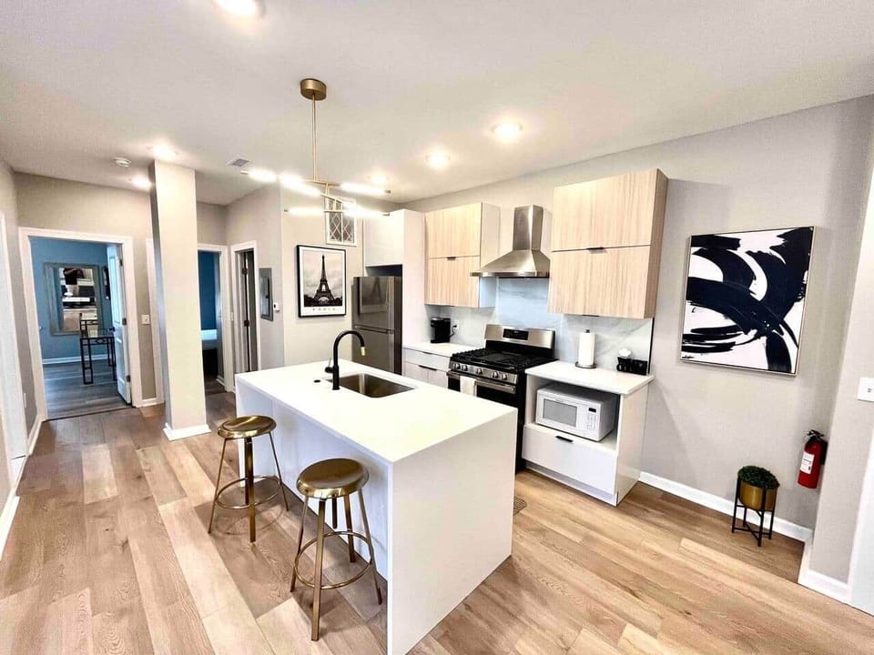 Full kitchen , breakfast waterfall quarts bar, range with hood,microwave, dishwasher, refrigerator, garbage disposal.