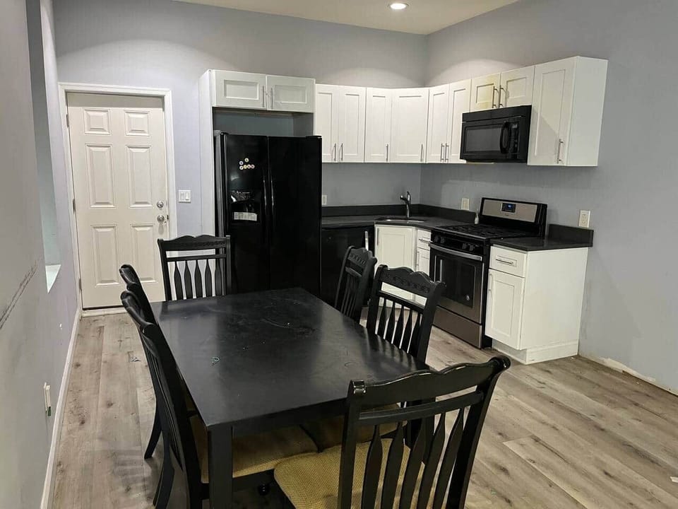 Dining table, full kitchen , dishwasher, range/oven, microwave, refrigerator.