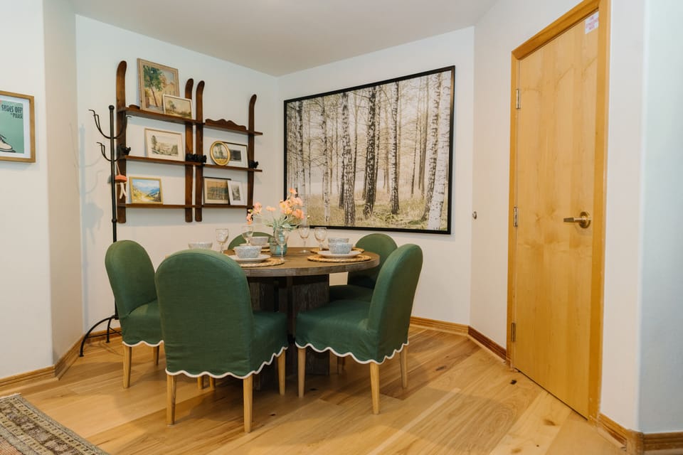 Dining room with seating for five. Closet to the right has boot dryers.
